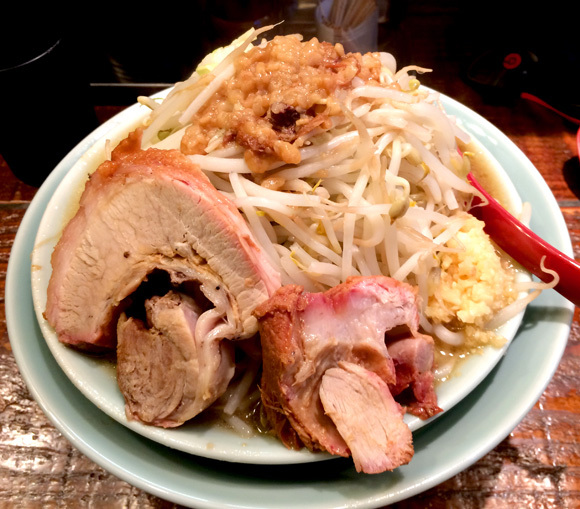 There’s something hiding beneath this mountain of ramen toppings, but it’s not ramen